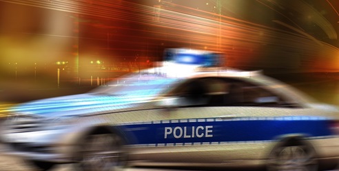 A police vehicle driving at a high speed
