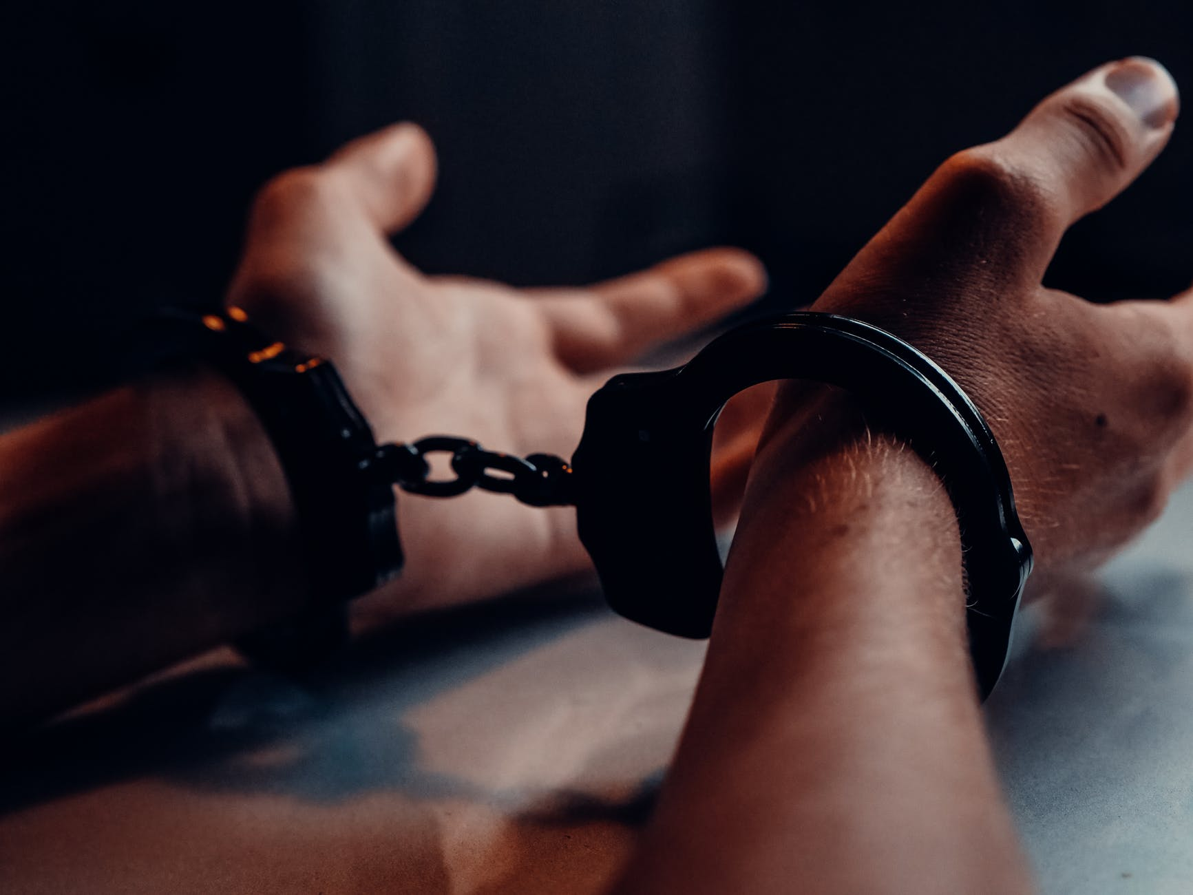 A man in handcuffs. 