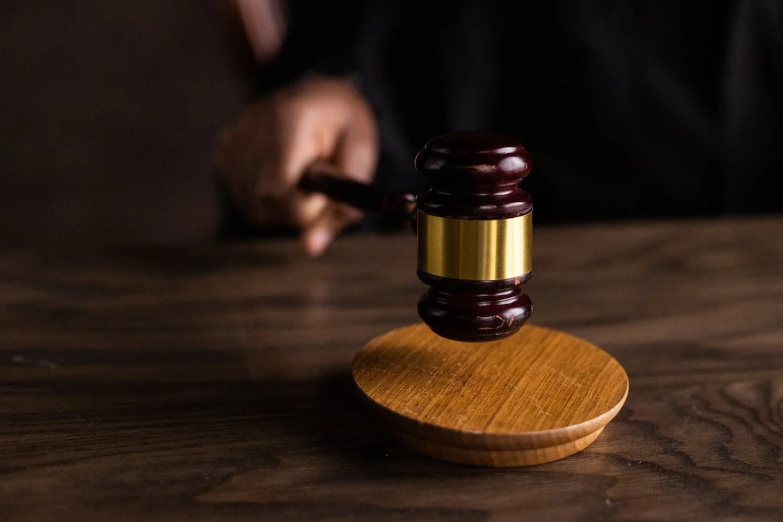 A gavel on a wooden table