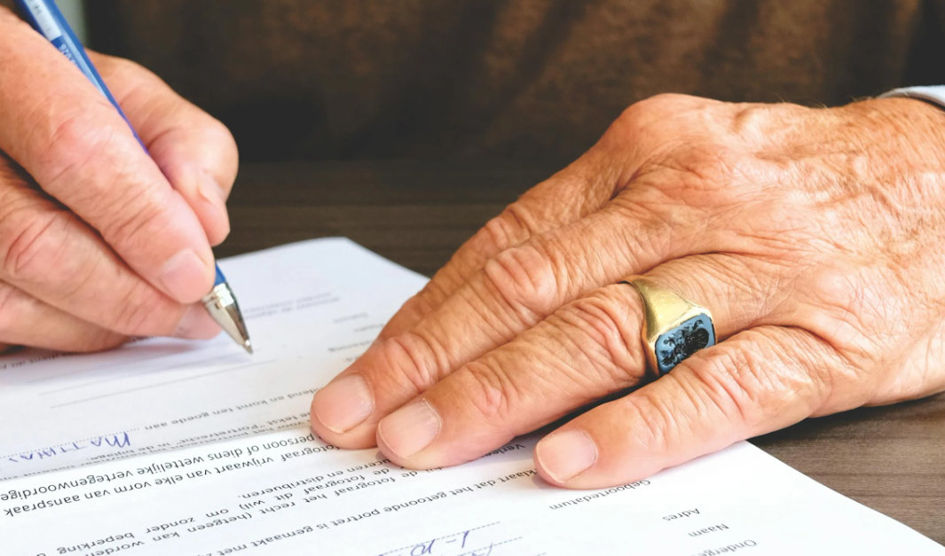 This image shows a co-signer signing a document.