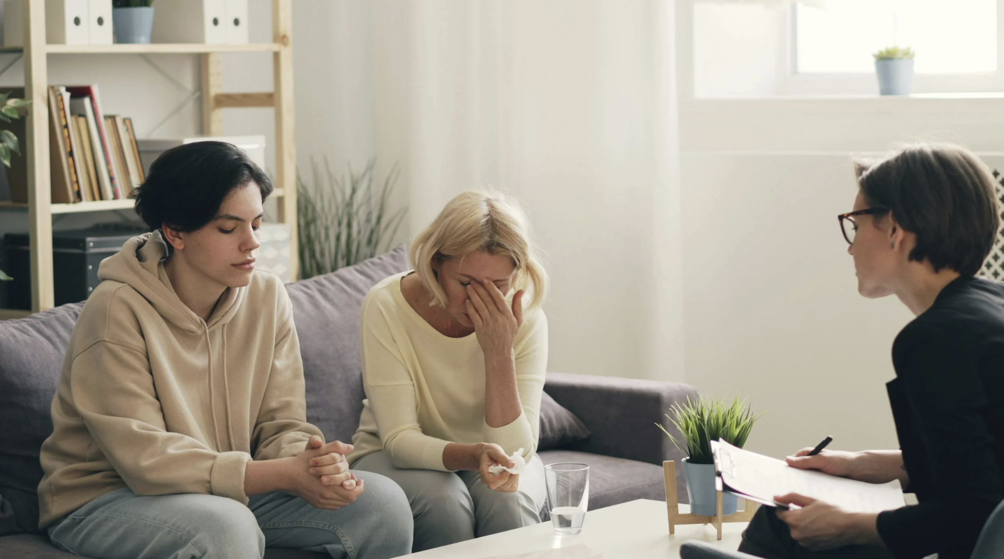 This photo shows a professional legal adviser explaining options to an upset client.