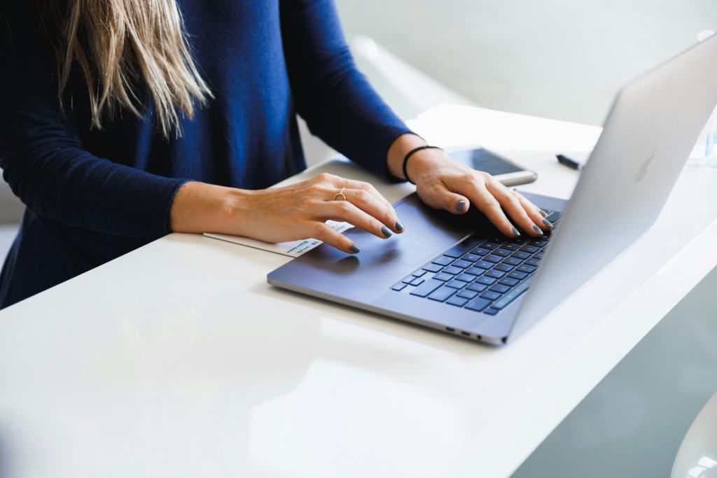 Woman using a laptop at a table