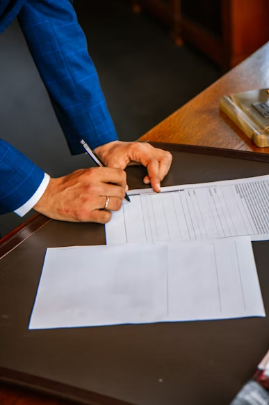 a man signing documents