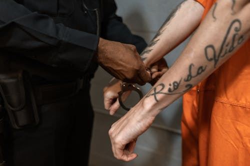  An officer removing handcuffs from a man 