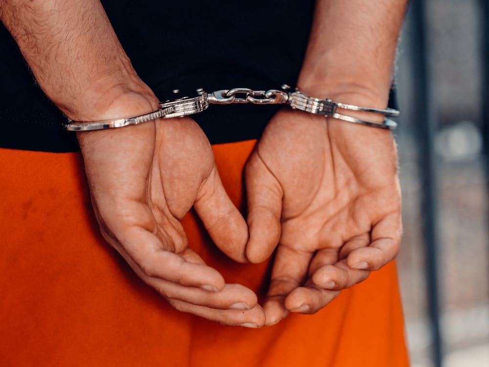 This photo shows a person with handcuffs.