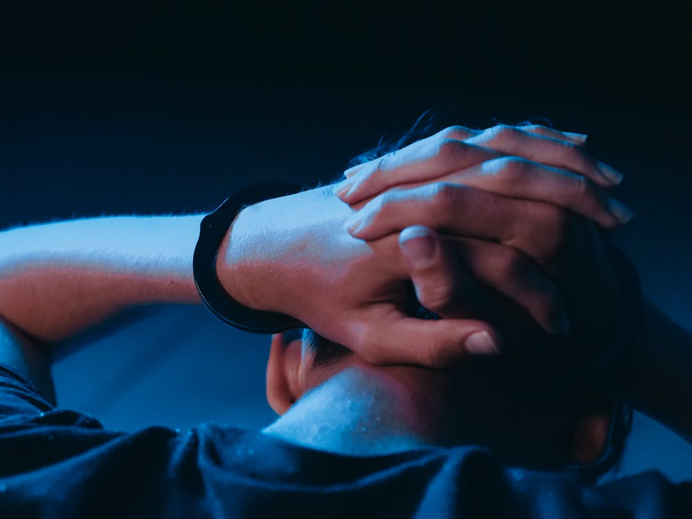 This photo shows a person with handcuffs.