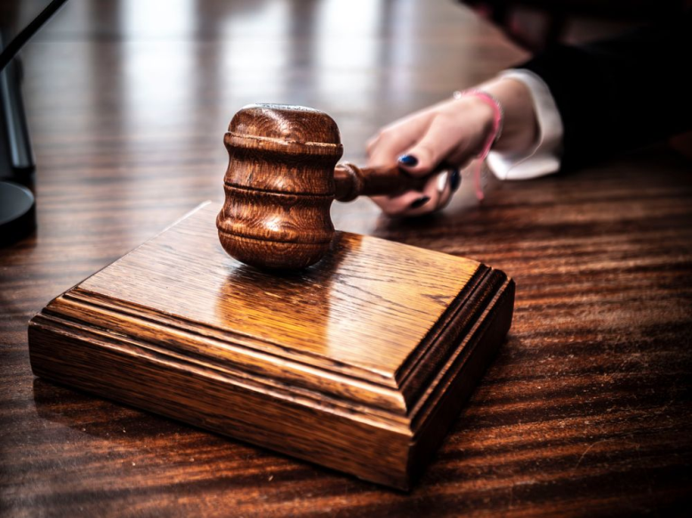 This photo shows a close-up of a gavel.